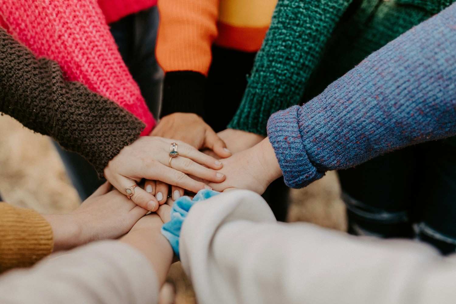 Many hands together warmly